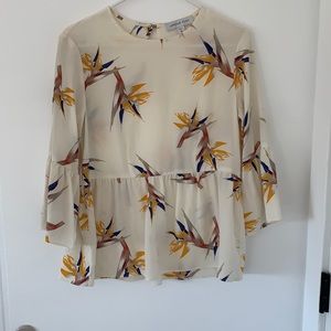 Amour Vert 100% silk peplum top.